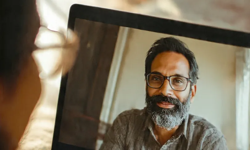 An advisor on a video call