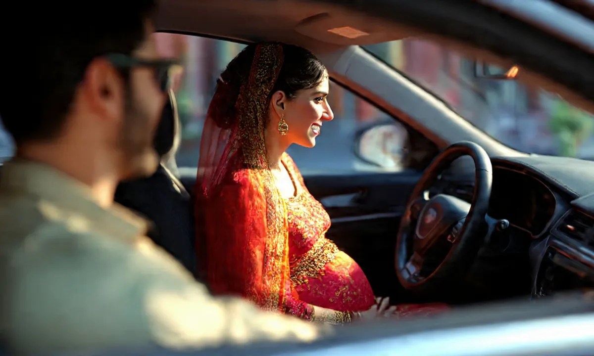 A couple setting off in their car